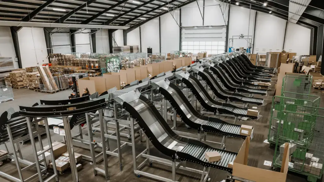 Long rows of HS roller conveyors in a sortation hall at DNMH